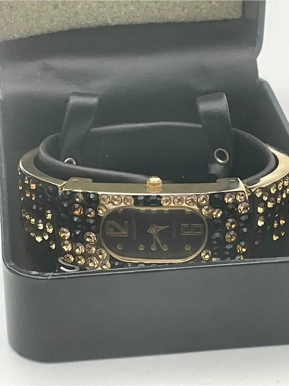 Gossip Gold-Tone Black and Champagne Crystal Bangle Watch. In original box.